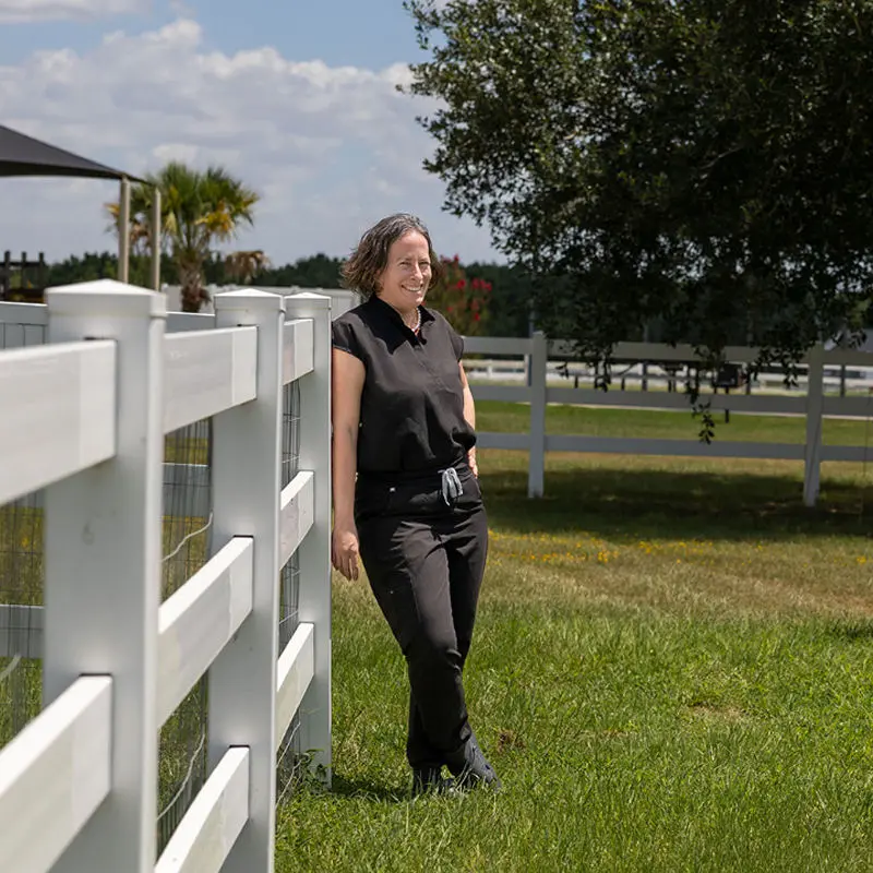 Alyson Bayer Alyson Bayer by a fence